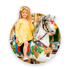 A cute girl riding a toy horse, amusement ride
