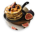 Small thick pancakes prepared on kefir and decorated with fruits