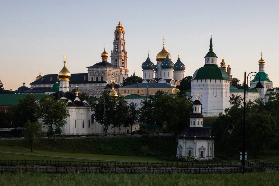 View of a monastery. Architectural ensemble of Orthodox churches and buildings surrounded with white wall
