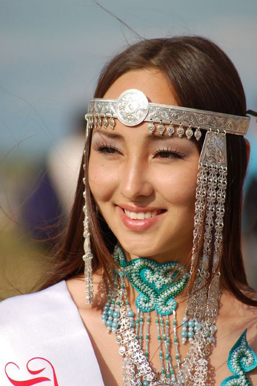 A beautiful Yakut woman wearing traditional jewelry