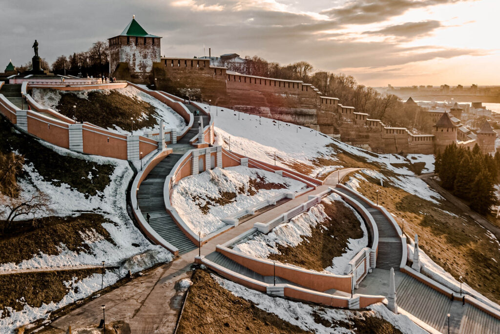 A redbrick wall of Kremlin and a flight of stairs in winter