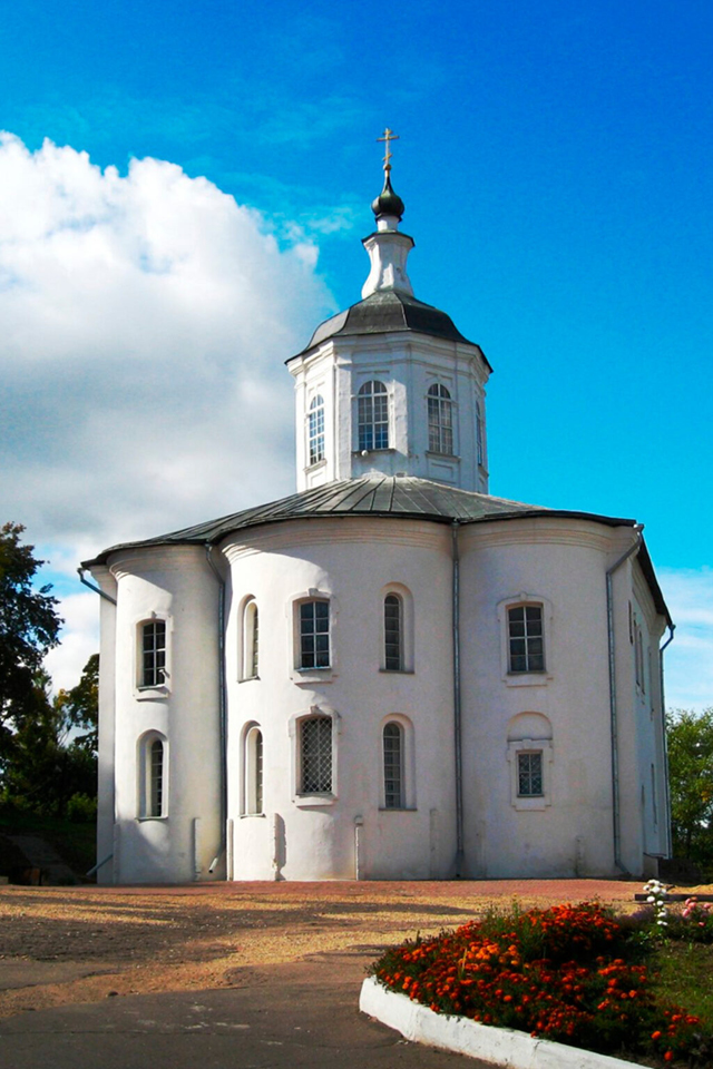 A modest white church with a single dome and very few decorations