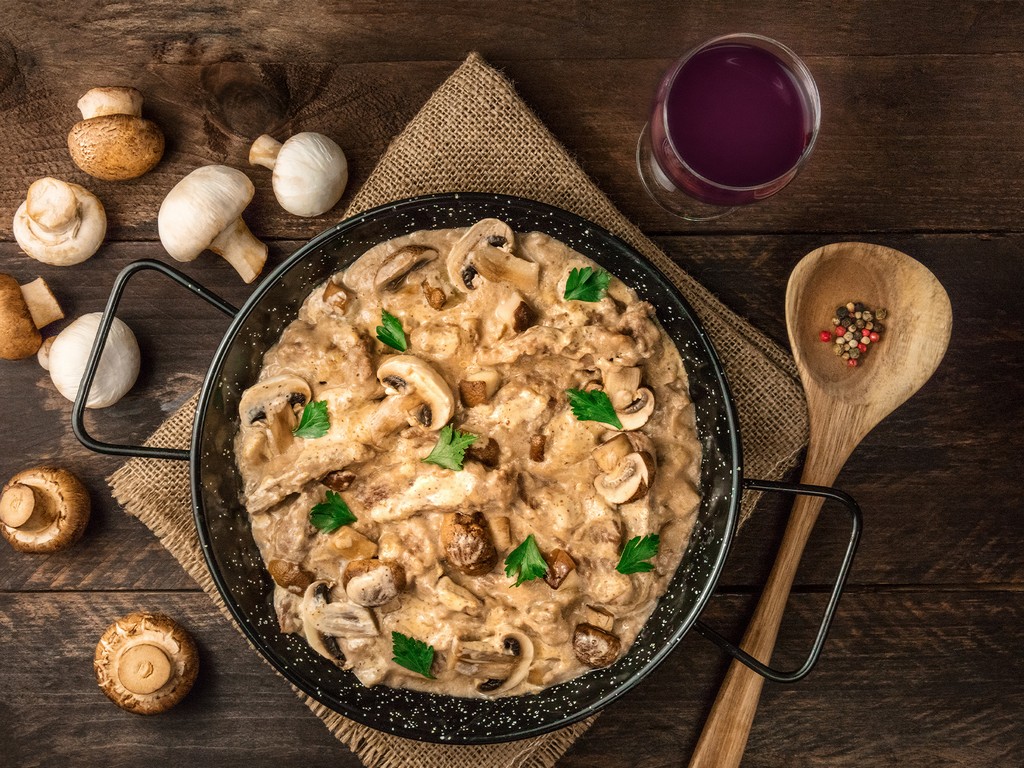 A casserole with Beef Stroganoff (dish of chopped beef and mushrooms in creamy sauce) served at a restaurant
