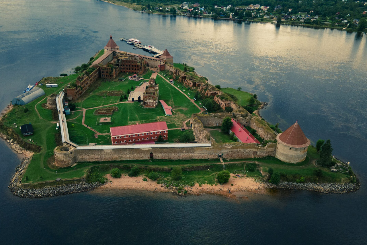 A fortress with round towers on an island