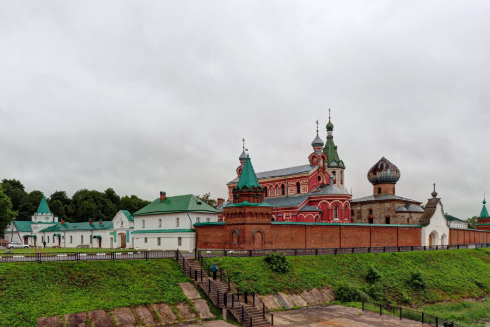 A monastery with white and red buildings