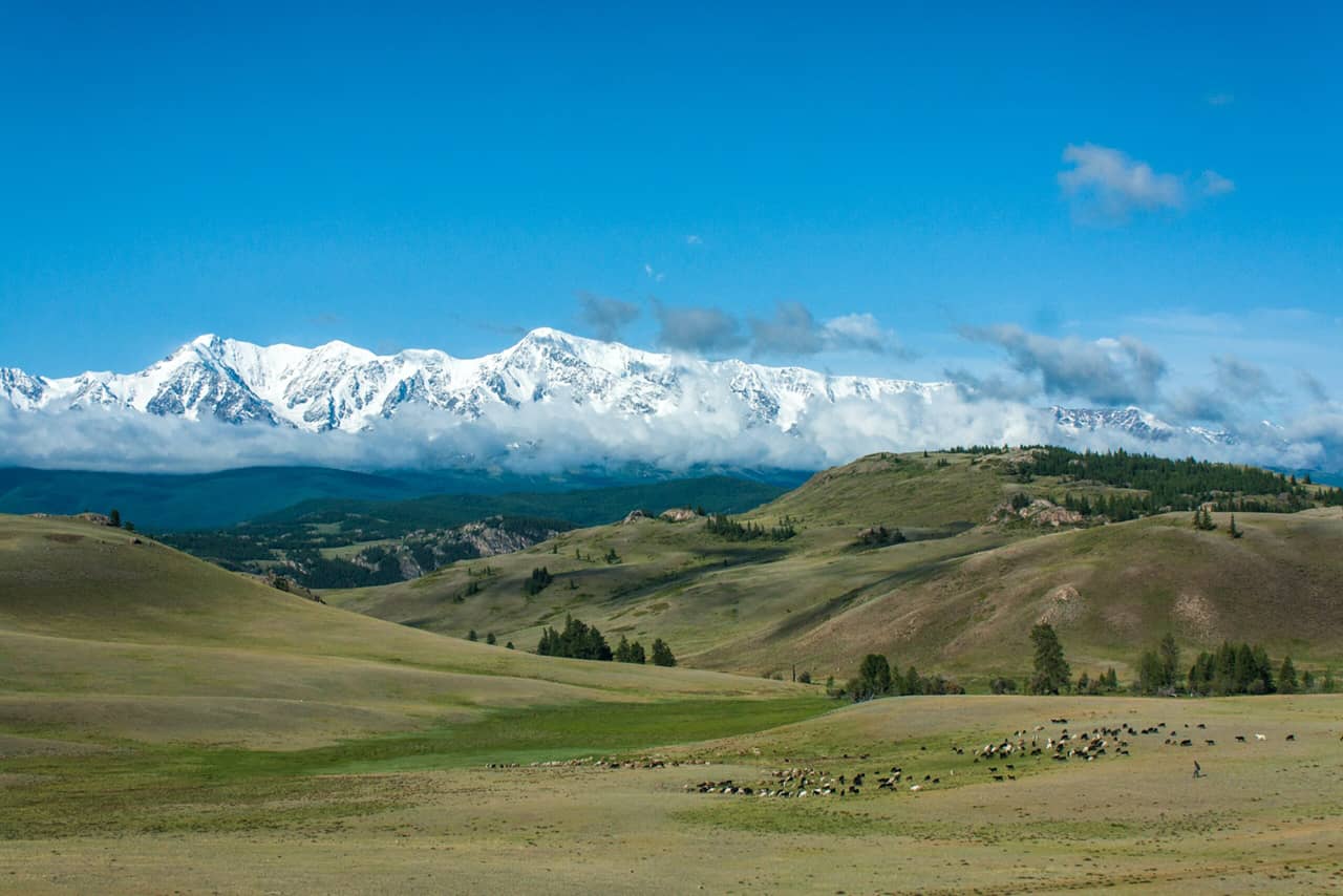 Beautiful landscape with mountains, snowy peaks in the background