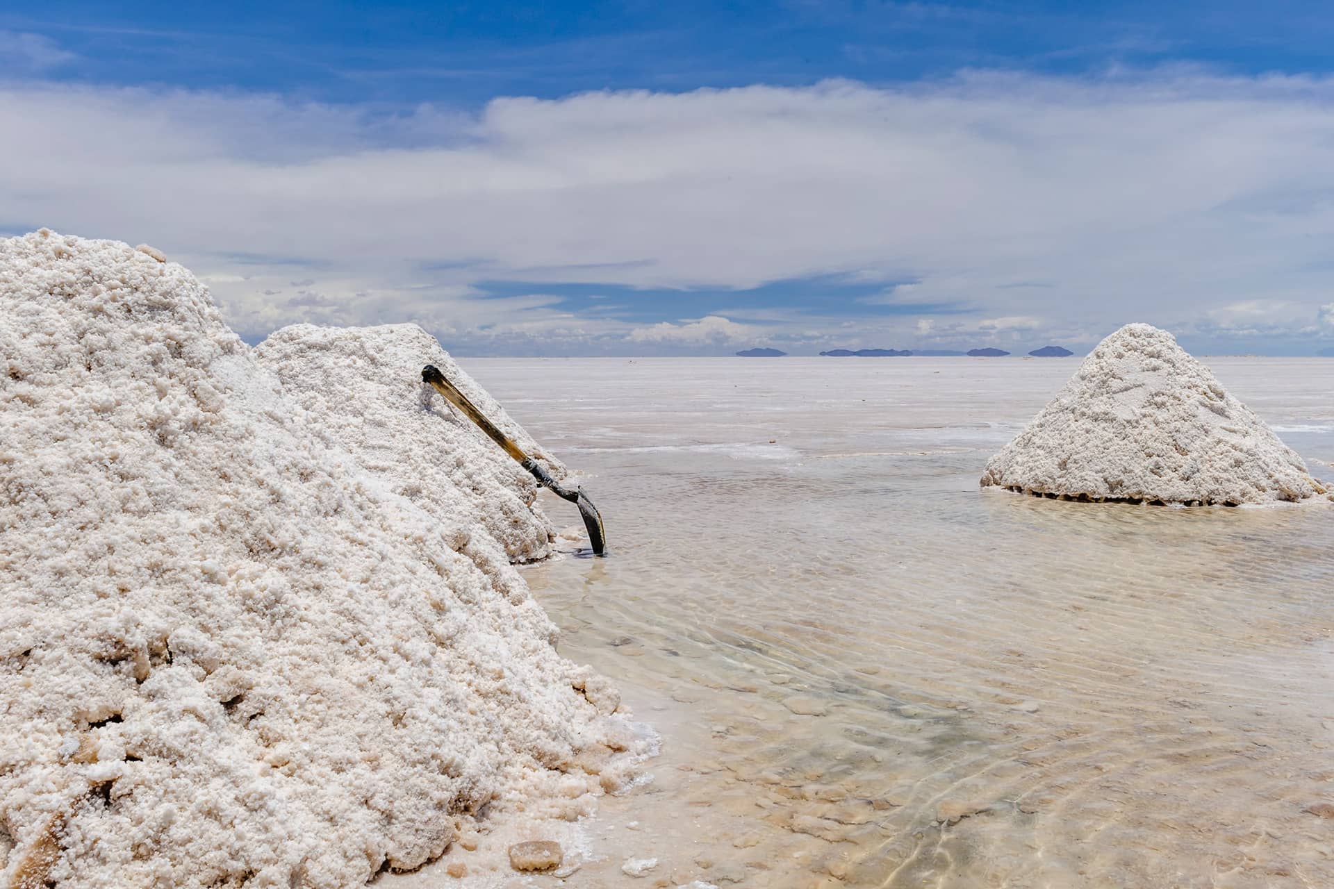 A white salt lake looking like snow, heaps of salt in a lake