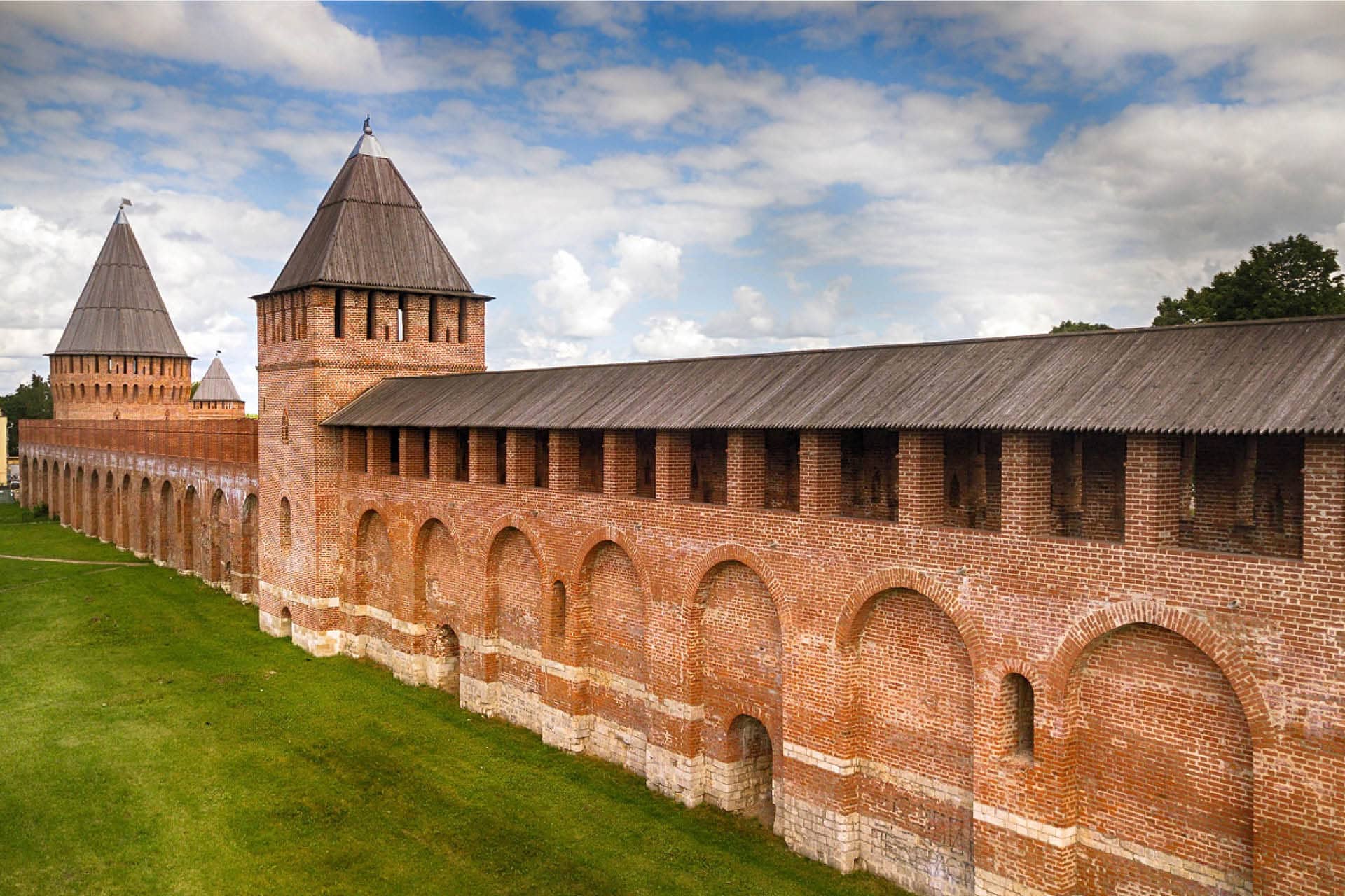 A red brick wall of the Russian Kremlin with a quadrate tower