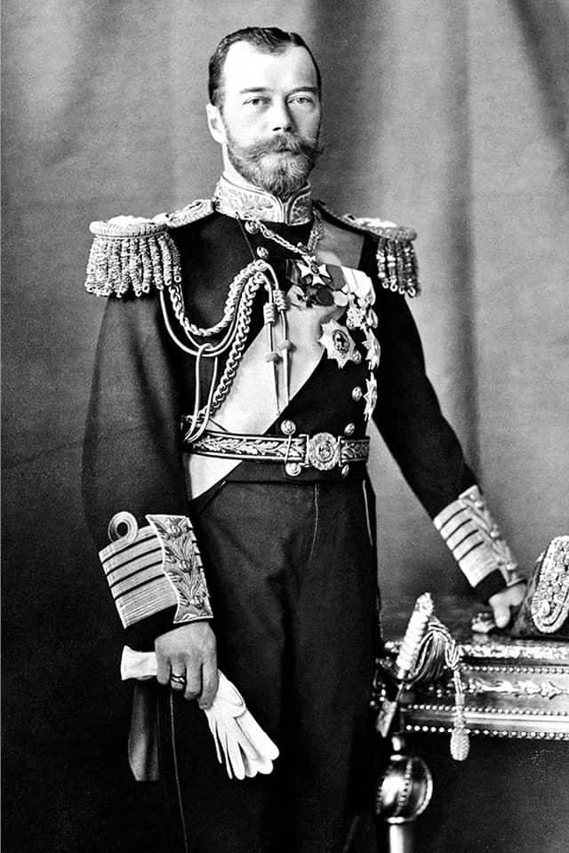 A black and white portrait of a standing man wearing 19th century suit with orders, portrait of Russian imperator