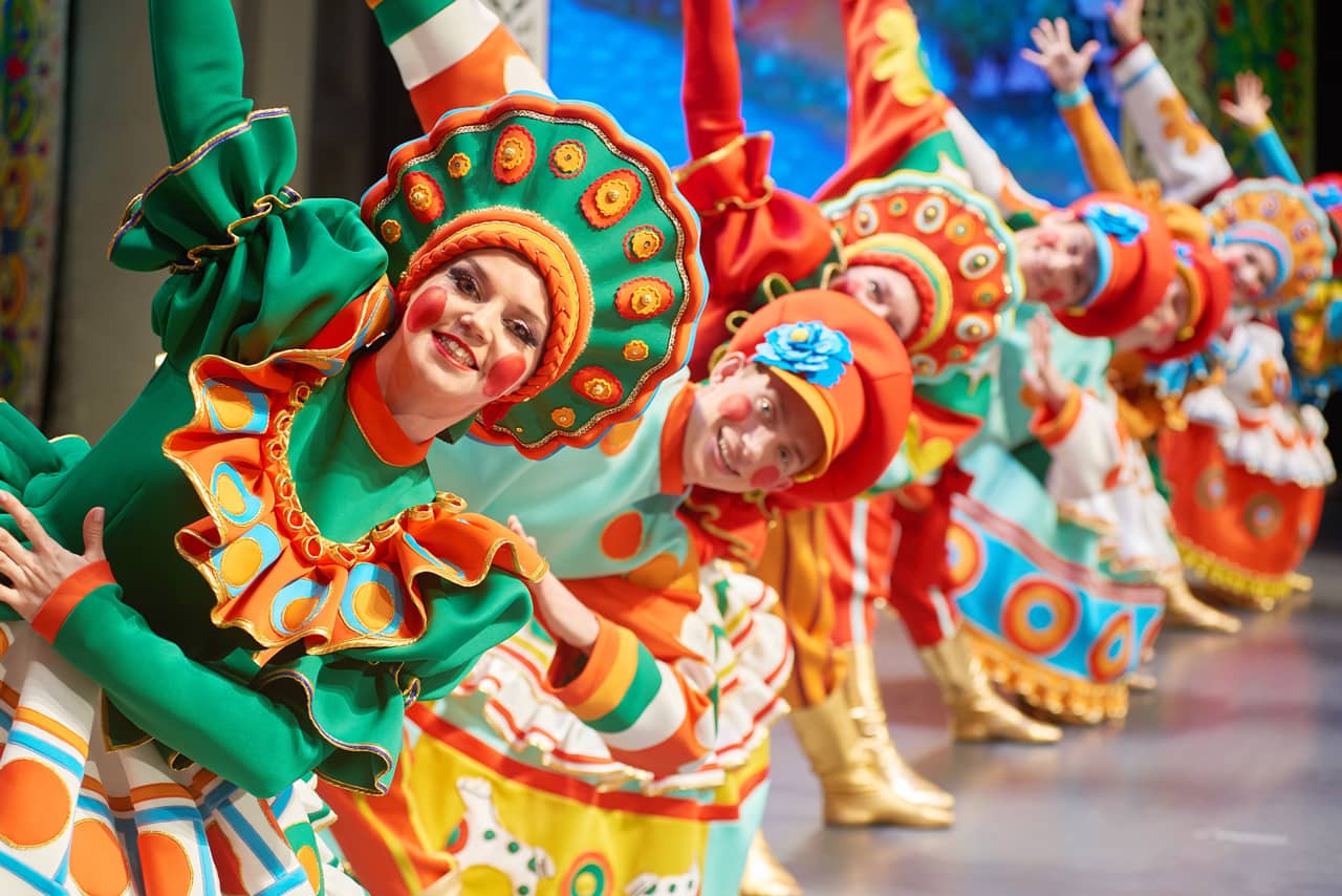 Dancers wearing bright traditional costumes, folk show