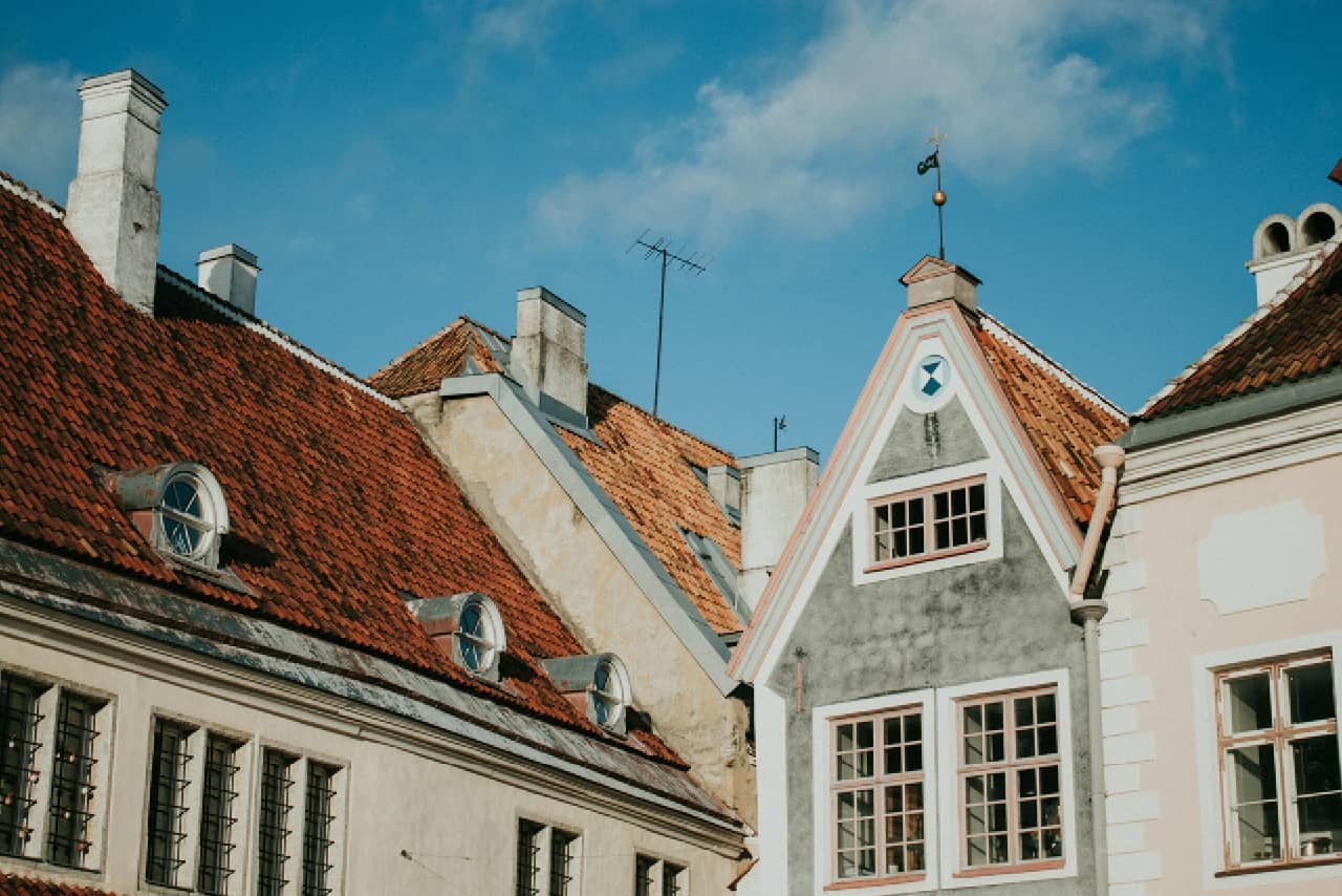 The upper part of old Estonian houses with tile roofs