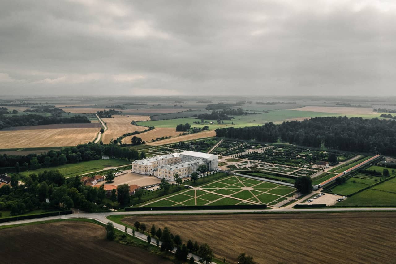 Aerial view of a baroque palace with a patio located in the countryside Aerial view of a baroque palace with a patio located in the countryside