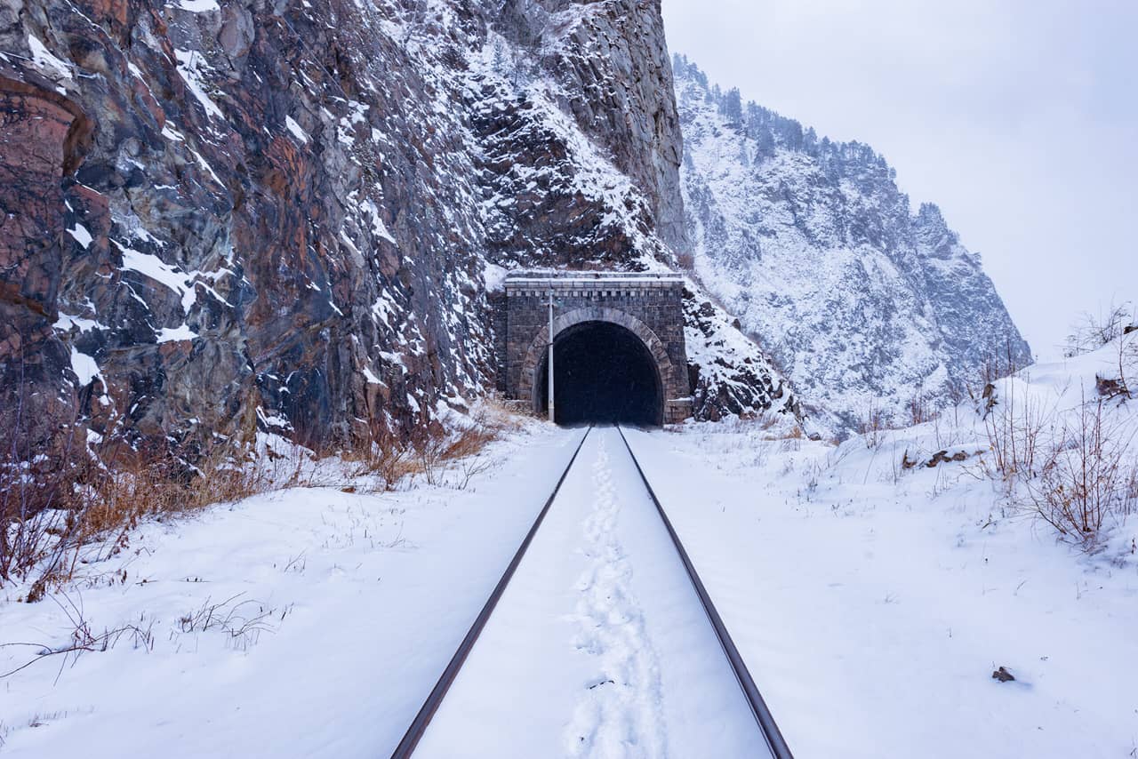 Railway through the rock, railway tunnel in winter