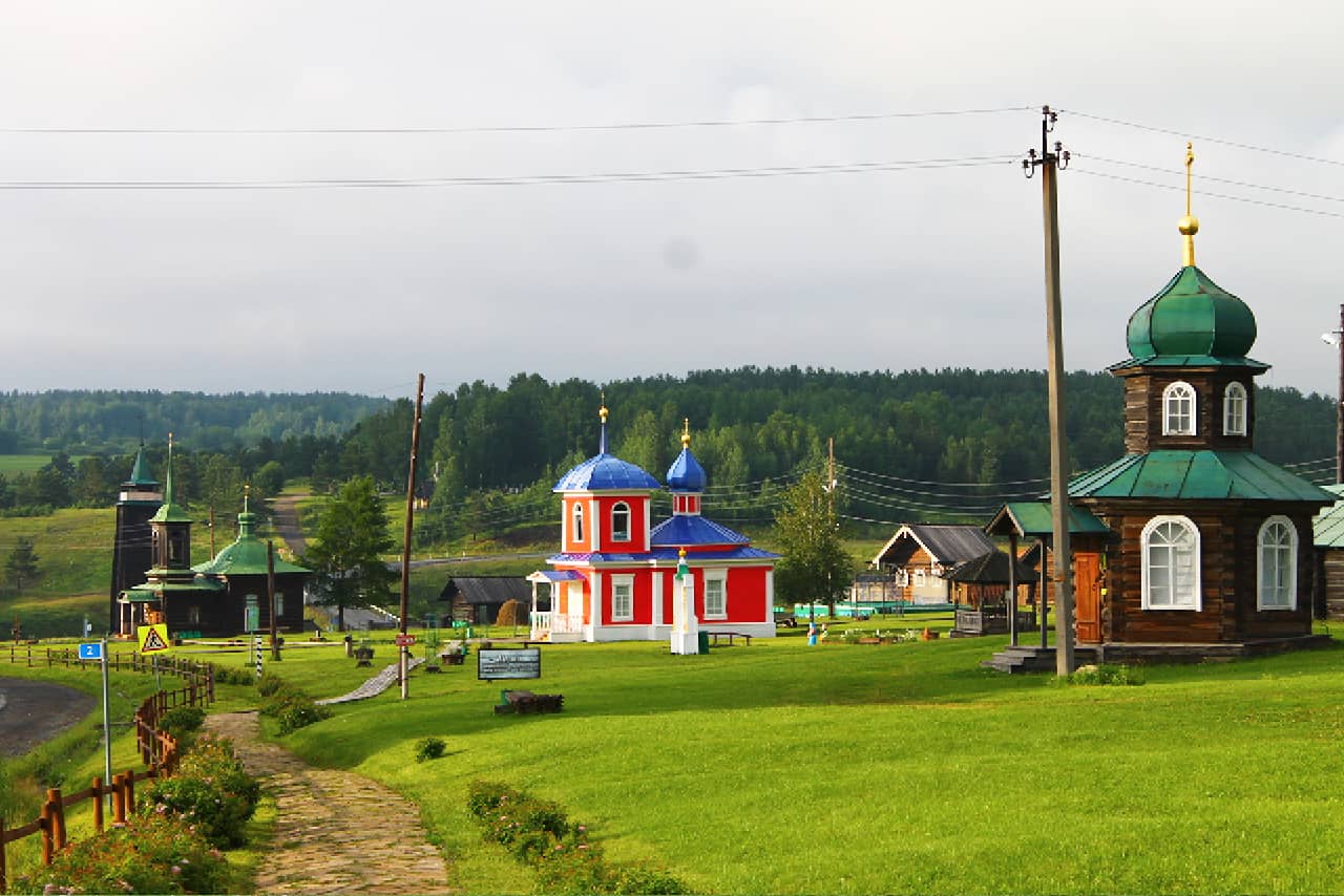 Several small wooden churches in the countryside of Russia