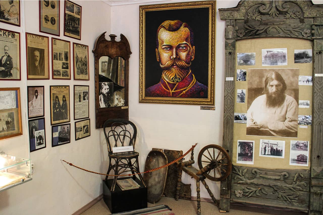 A room in a museum with portraits on the walls, portrait of a Russian imperator